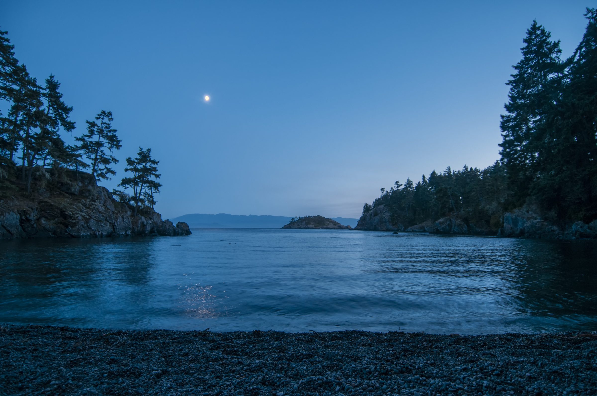 Twilight over a sheltered East Sooke cove where forest meets the sea